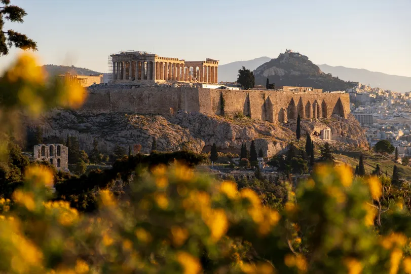 Panoramic view of Athens with urban and natural scenery.